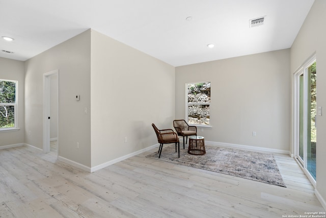 unfurnished room with light wood-type flooring