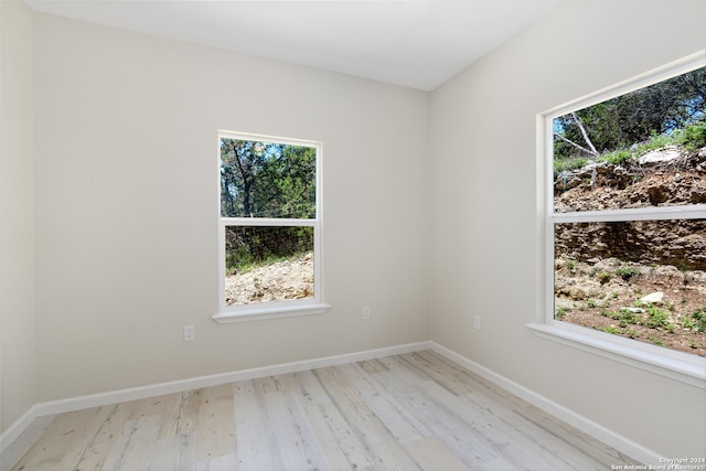 spare room featuring light hardwood / wood-style floors