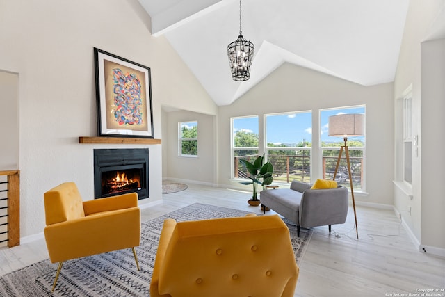 living room featuring high vaulted ceiling, beam ceiling, a chandelier, and light hardwood / wood-style floors