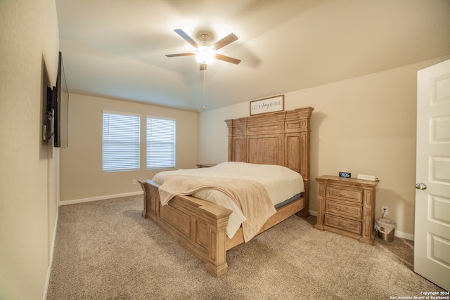 bedroom with light carpet, ceiling fan, and lofted ceiling