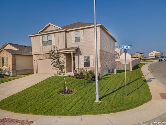 view of front facade with a garage and a front lawn