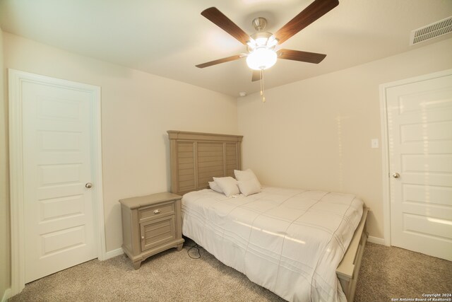 bedroom featuring ceiling fan and light colored carpet