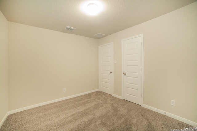 unfurnished bedroom with a closet and carpet