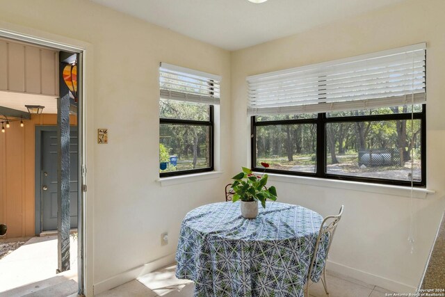 dining area featuring tile floors and a healthy amount of sunlight