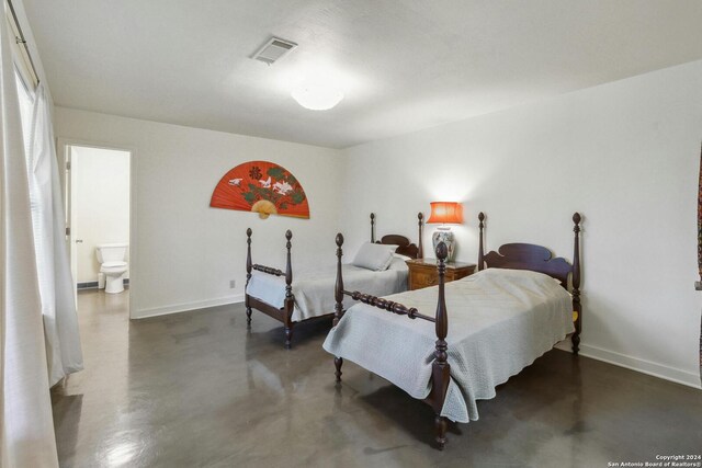 bedroom with connected bathroom