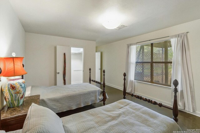 bedroom with hardwood / wood-style floors