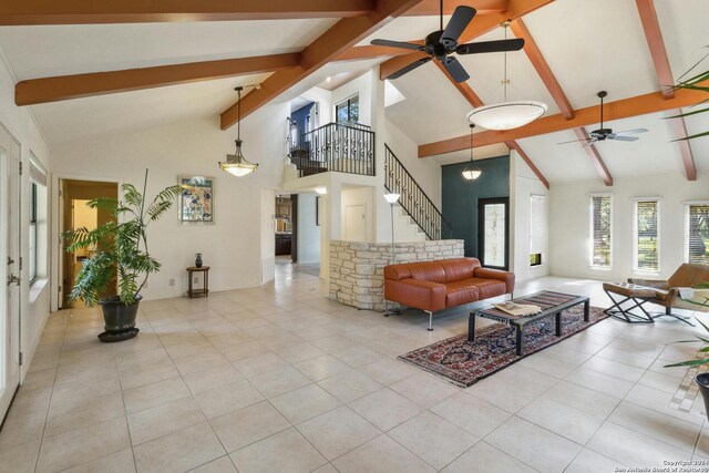 living room with high vaulted ceiling, beamed ceiling, ceiling fan, and light tile floors