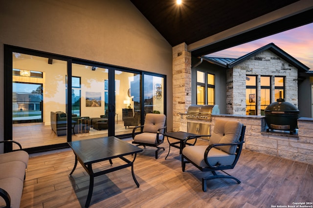 patio terrace at dusk with grilling area and area for grilling