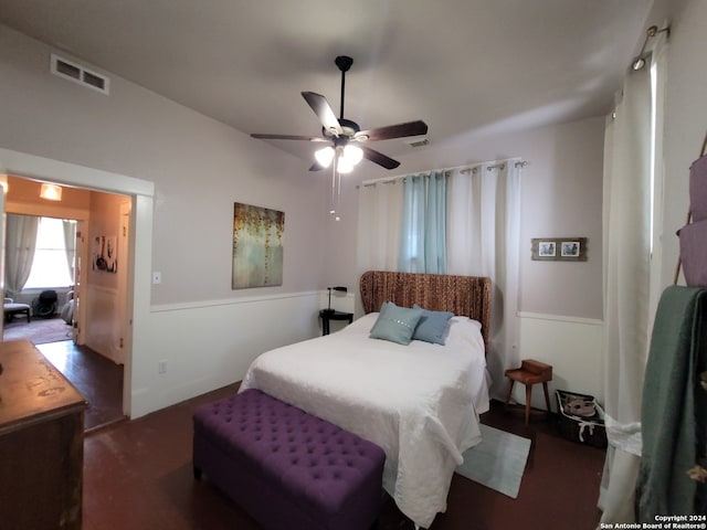 bedroom featuring ceiling fan and dark hardwood / wood-style flooring