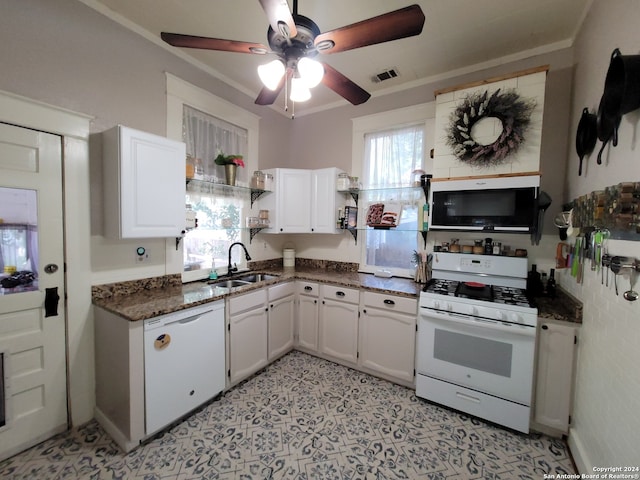 kitchen with ceiling fan, white cabinetry, sink, white appliances, and light tile floors