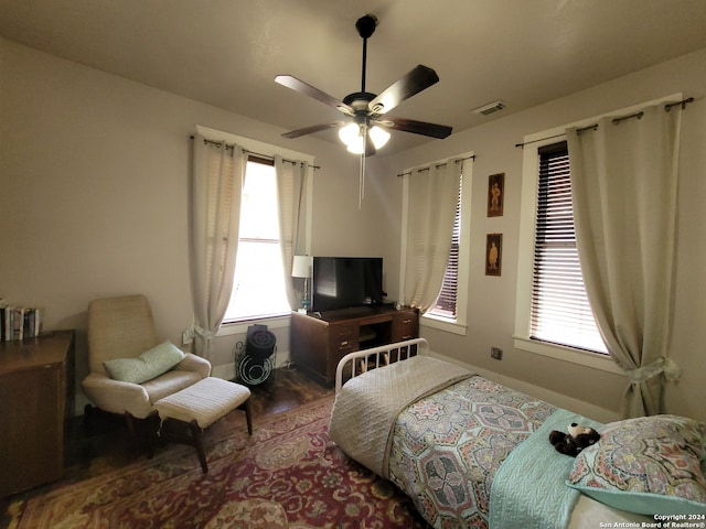 bedroom with ceiling fan and hardwood / wood-style floors