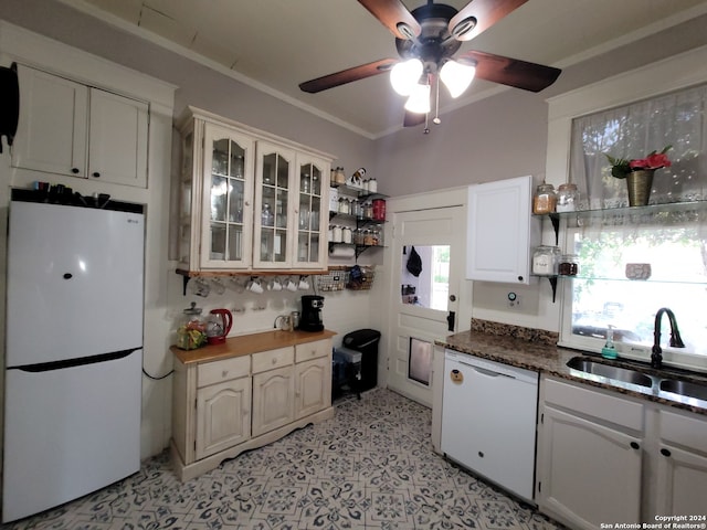 kitchen featuring ornamental molding, white appliances, white cabinets, sink, and ceiling fan