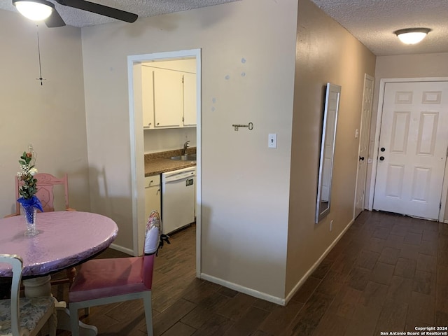 923 Vance Jackson Rd Unit 108A, San Antonio, TX 78201 - kitchen featuring white dishwasher, a textured ceiling, dark wood-style flooring, a ceiling fan, and white cabinets