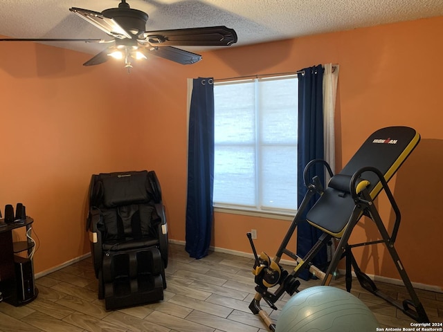 923 Vance Jackson Rd Unit 108A, San Antonio, TX 78201 - workout area with ceiling fan, a textured ceiling, wood finish floors, and baseboards