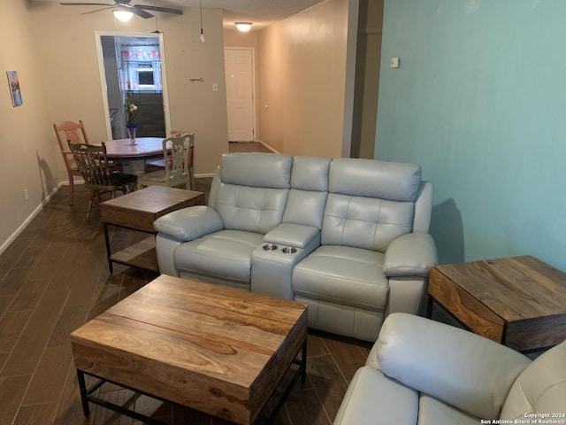 923 Vance Jackson Rd Unit 108A, San Antonio, TX 78201 - living area with a ceiling fan, dark wood-type flooring, and baseboards
