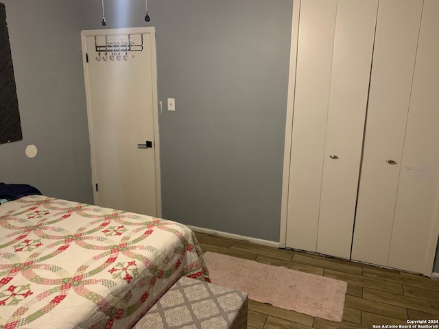 bedroom with hardwood / wood-style flooring