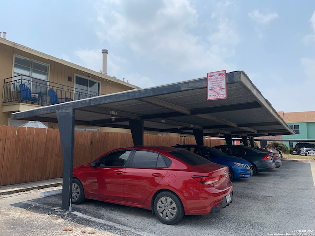 view of vehicle parking featuring a carport