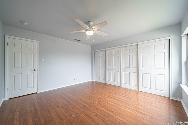 unfurnished bedroom featuring ceiling fan and wood-type flooring