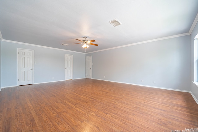 spare room featuring crown molding, ceiling fan, and wood-type flooring