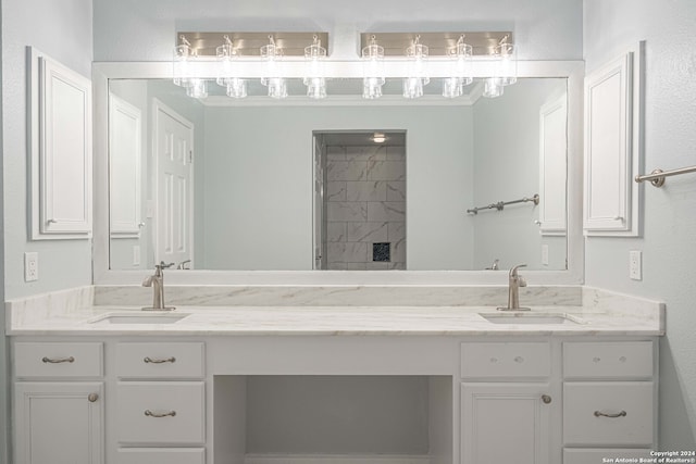 bathroom featuring vanity and a shower