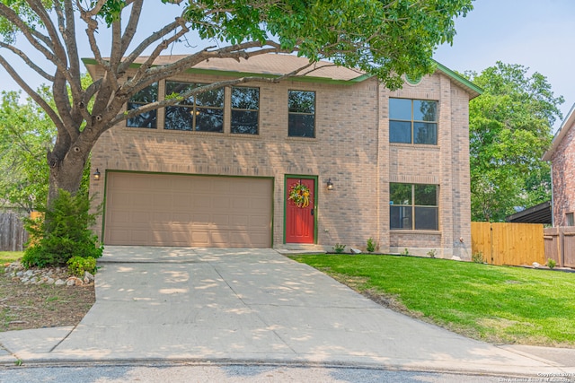 view of front of home with a garage and a front yard