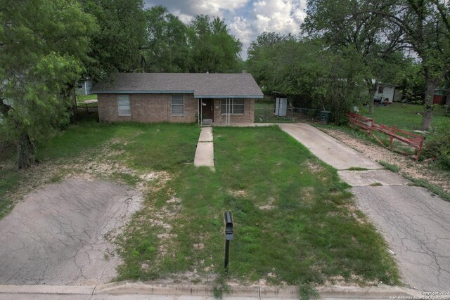 ranch-style house with a front lawn