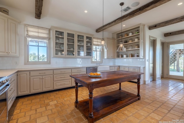 kitchen with tasteful backsplash, pendant lighting, and beam ceiling