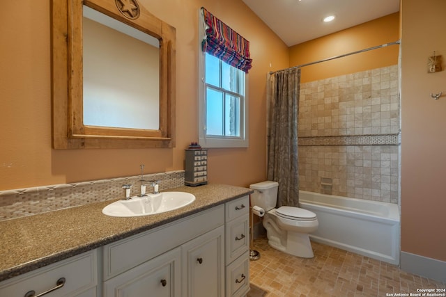 full bathroom featuring vanity, toilet, and shower / bath combo with shower curtain