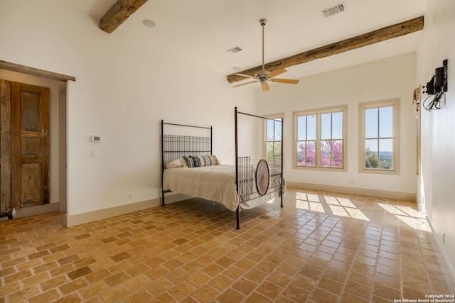 bedroom featuring beam ceiling and ceiling fan