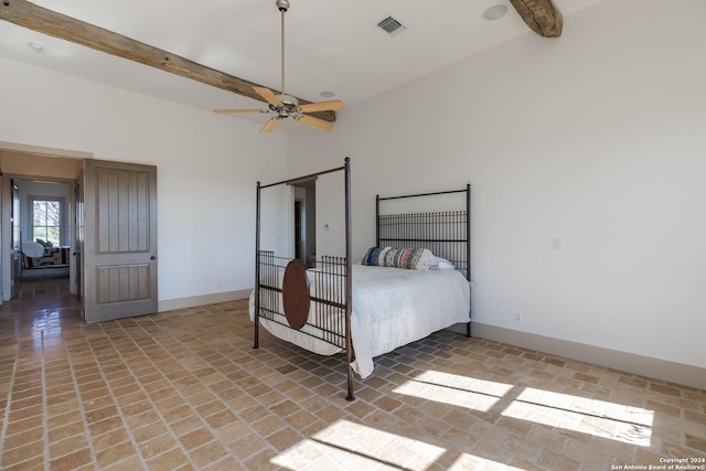 bedroom featuring beam ceiling and ceiling fan