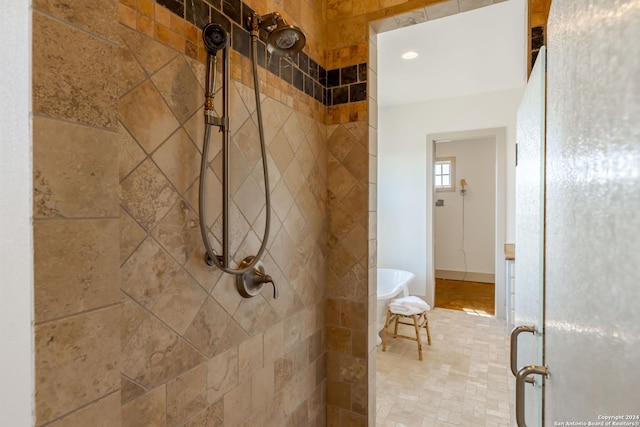 bathroom with a shower with shower door