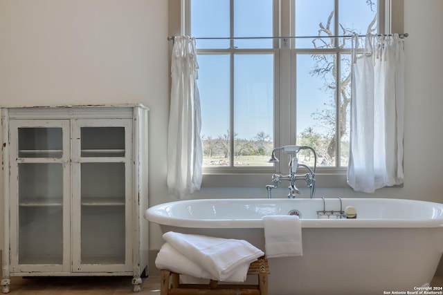 bathroom featuring a bath