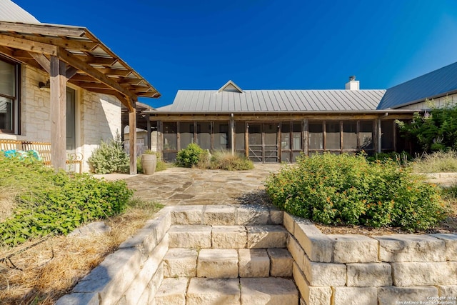 view of yard with a sunroom