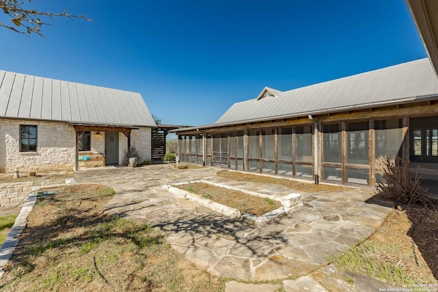 view of yard with a sunroom