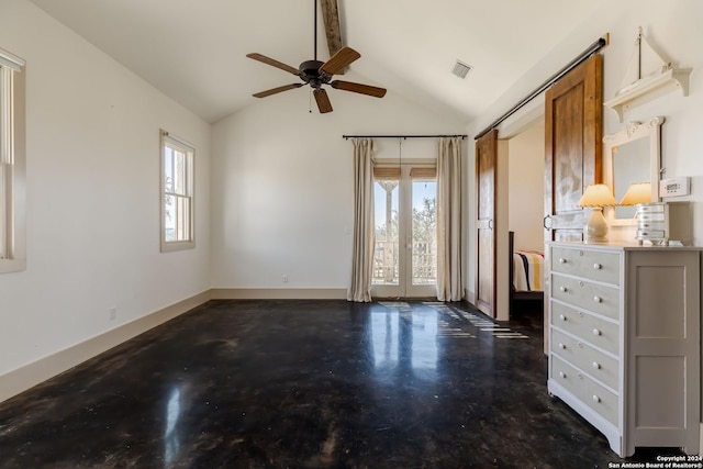 interior space featuring ceiling fan and lofted ceiling