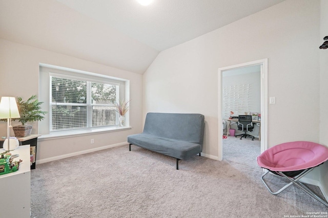 sitting room with baseboards, carpet flooring, and vaulted ceiling