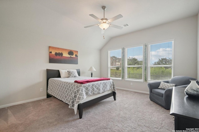 carpeted bedroom featuring visible vents, baseboards, lofted ceiling, and ceiling fan