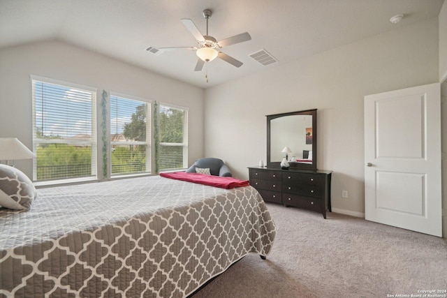 bedroom featuring baseboards, visible vents, ceiling fan, vaulted ceiling, and carpet flooring