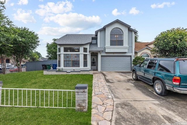 view of property with a front yard and a garage