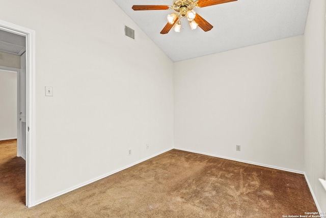 carpeted empty room with ceiling fan and lofted ceiling