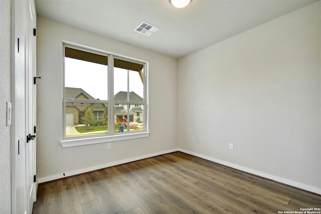 empty room featuring hardwood / wood-style floors