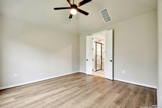 unfurnished room with light wood-type flooring and ceiling fan