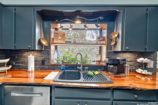 kitchen with blue cabinetry and sink