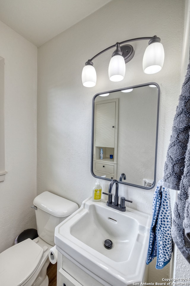 bathroom featuring toilet and sink