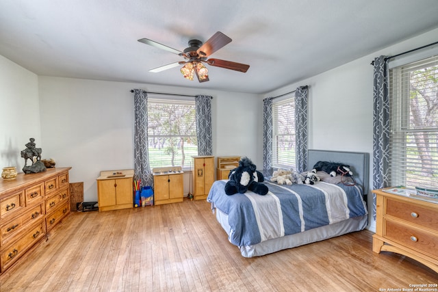 bedroom with light hardwood / wood-style flooring and ceiling fan