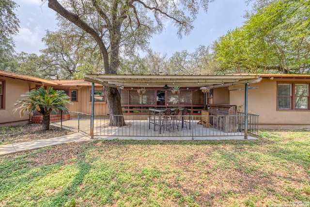 rear view of house with a patio