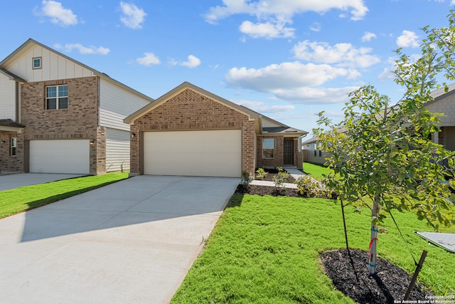 view of front of house with a front yard and a garage