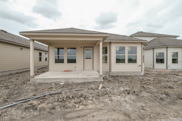 back of house with a patio area