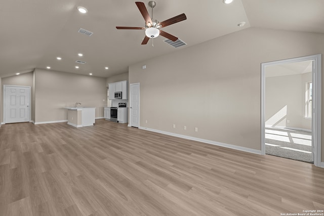 unfurnished living room featuring ceiling fan, light hardwood / wood-style flooring, and lofted ceiling