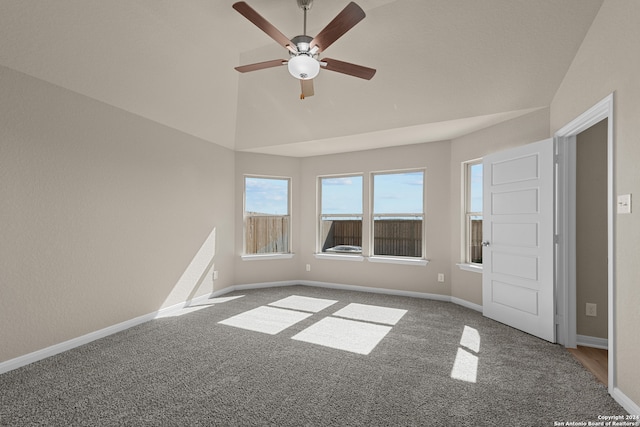 spare room with ceiling fan, carpet, and lofted ceiling